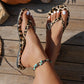 Flip-Flops mit Leopardenmuster und Herzanhänger